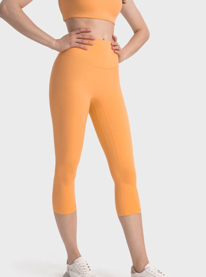 Pantalon de yoga extensible taille haute orange pour exercices